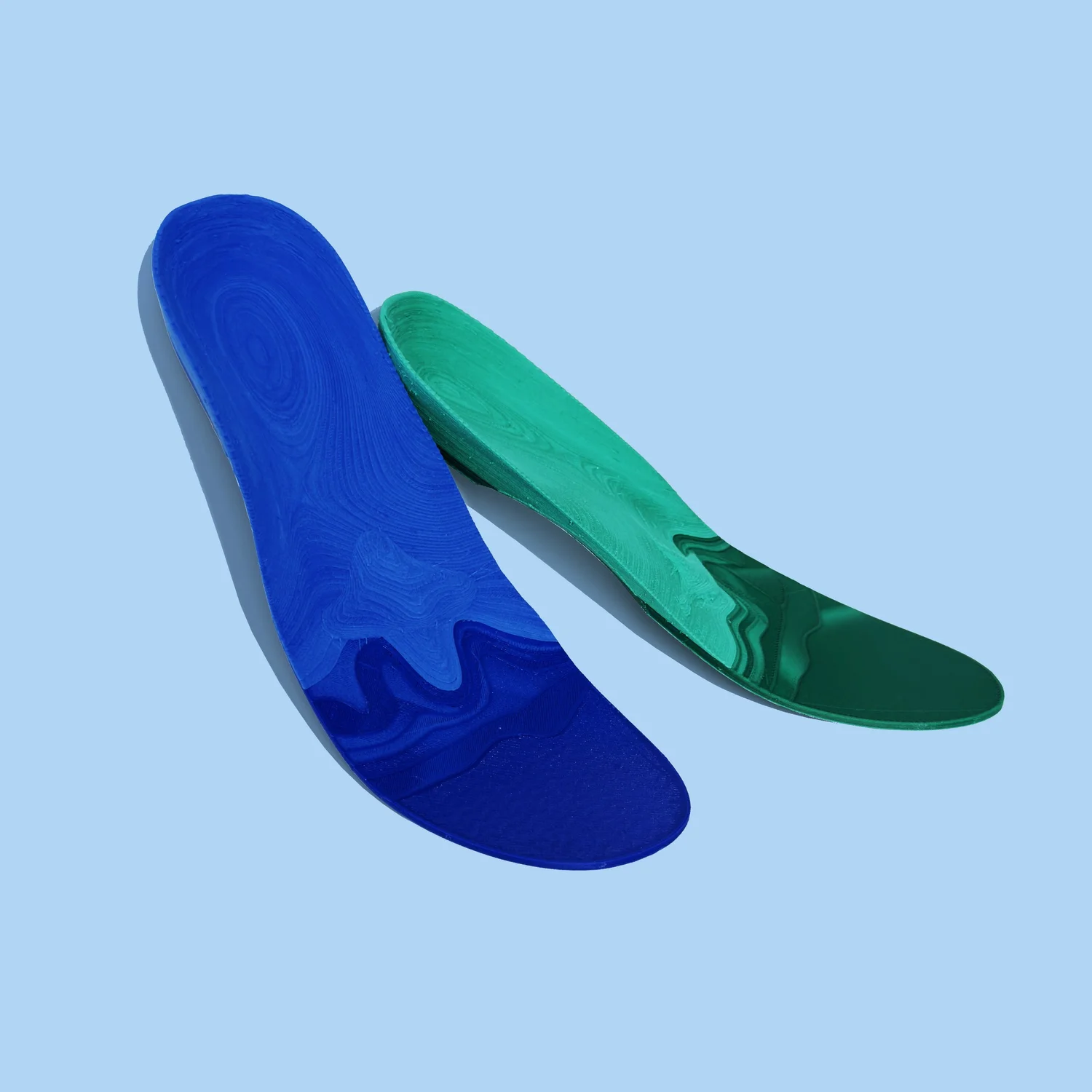 Ridgeline custom orthotics — a finished pair in royal blue and deep green